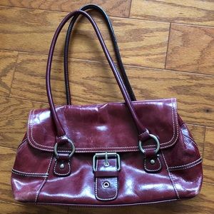 Red leather bag with belt buckle decor